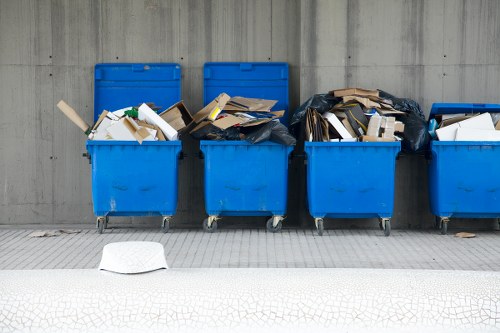 Vans and team loading commercial waste outside a Croydon shop