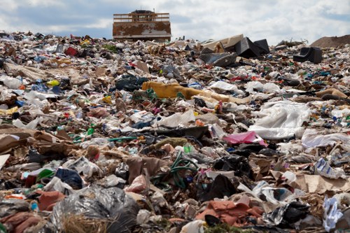 Workers sorting recyclables at a commercial collection point in Croydon